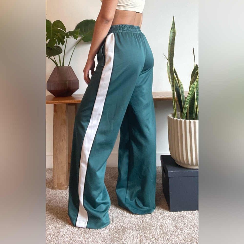 Emerald/ forest green track pants. Model is 5’0”- 110lbs for reference.